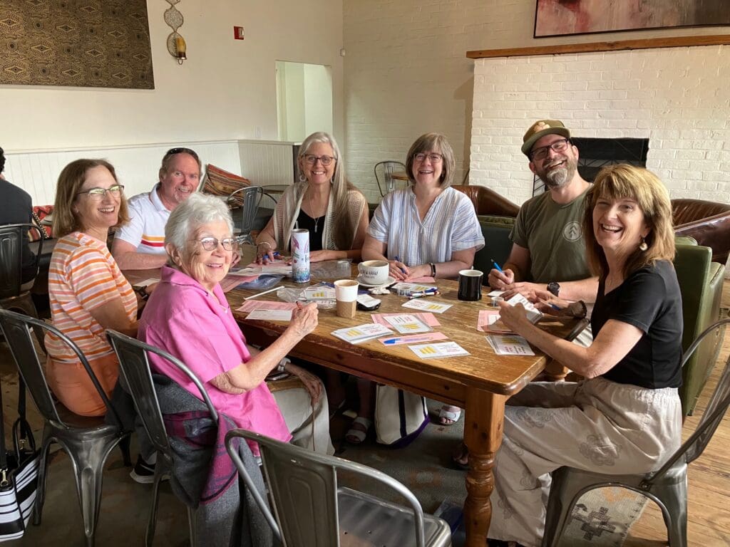 Delaware Citizens' Climate Lobby volunteers writing postcards