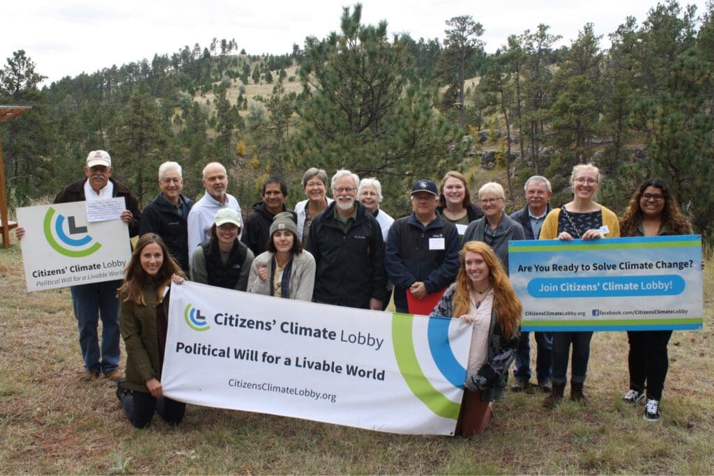 South Dakota Citizens' Climate Lobby volunteers with a CCL banner