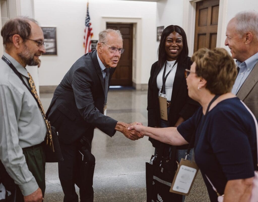 Volunteers shaking hands in the capitol